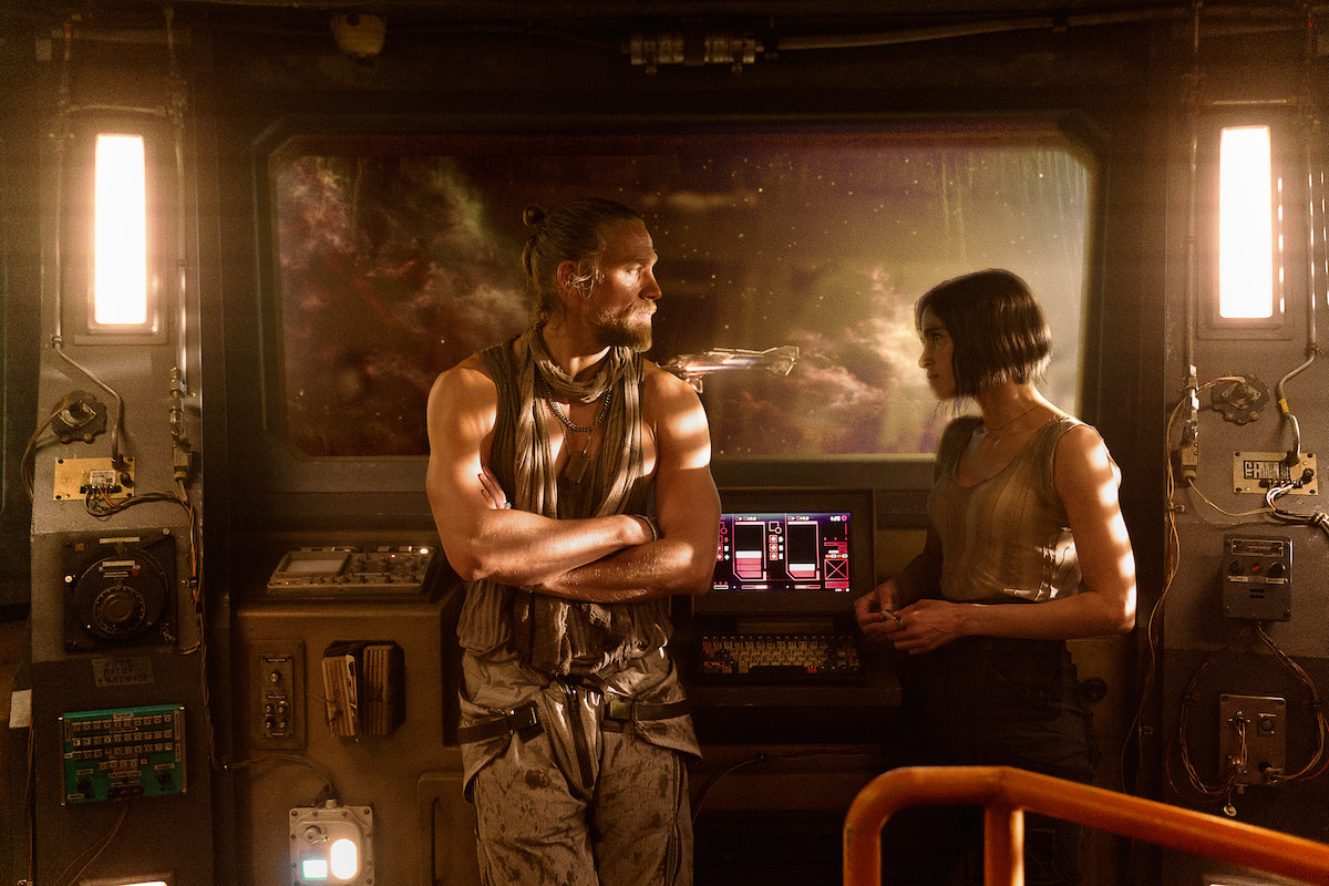 Charlie Hunnam as Kai and Sofia Boutella as Kora.