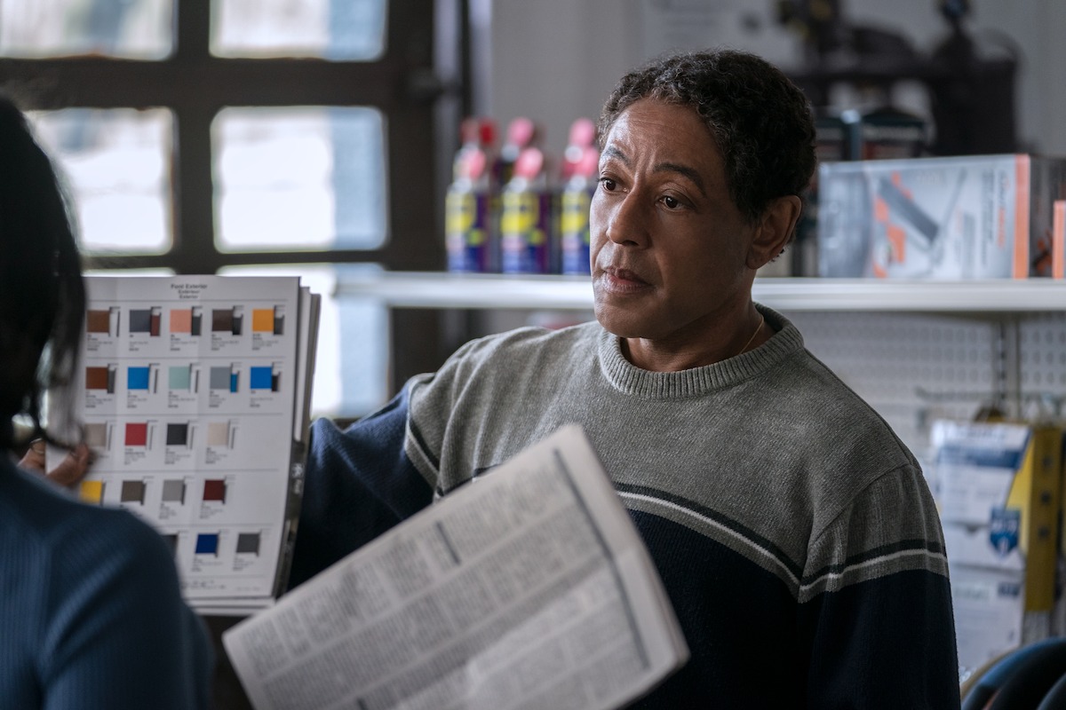 Ray (Giancarlo Esposito) in a store looking over color samples.