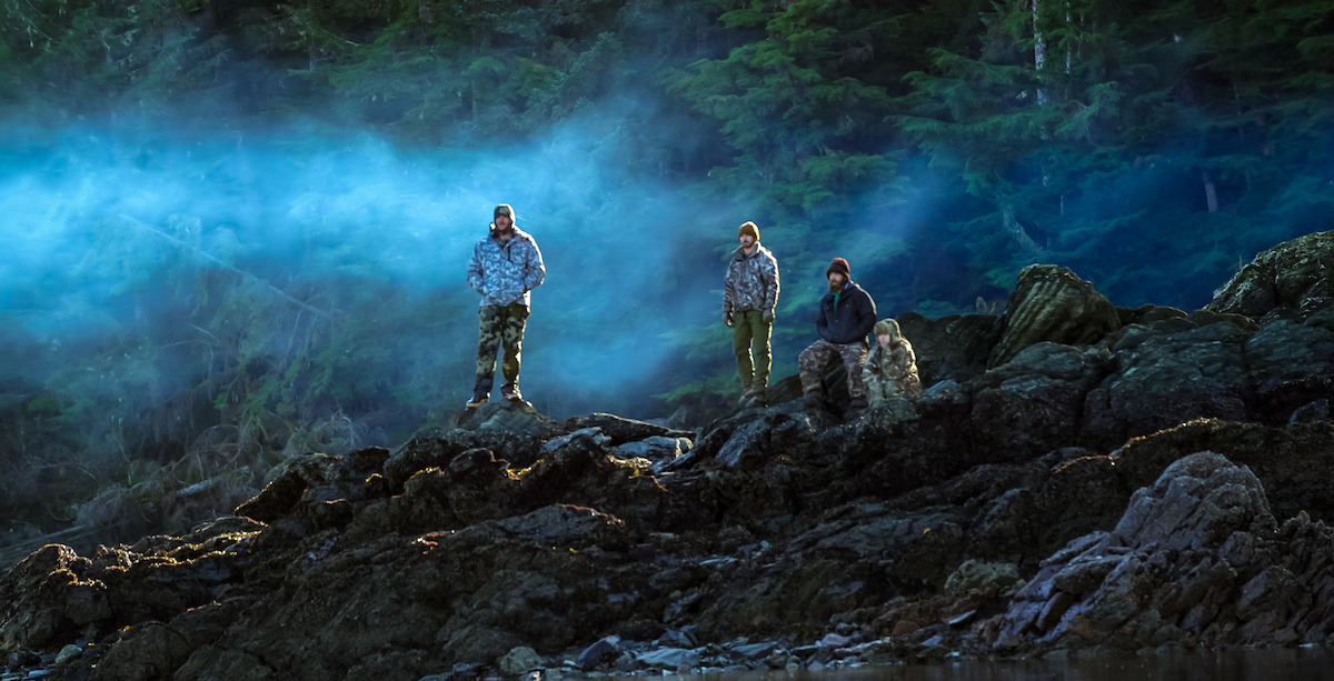 Drake Vliem, Drew Haas, Sammy Norris, and Bri Walston standing atop a mountain in Season 2 of ‘Outlast’.