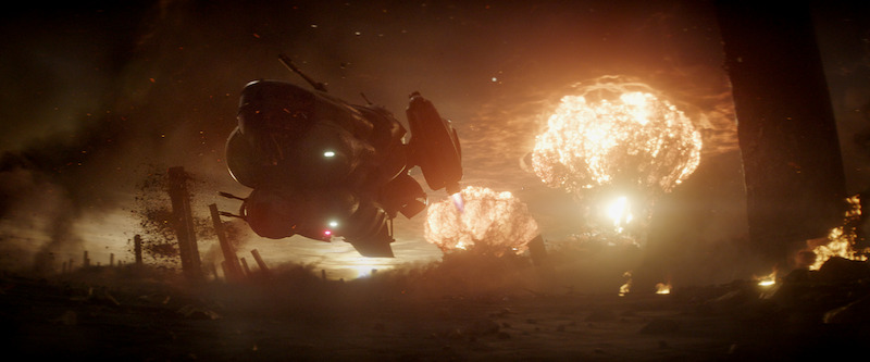A space ship takes off in front of an explosion