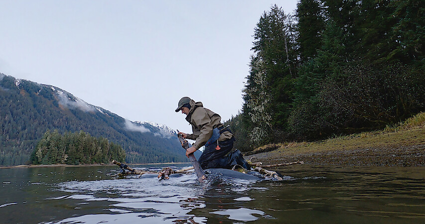 a man using a makeshift raft