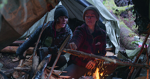 Jill and Amber tend to the fire