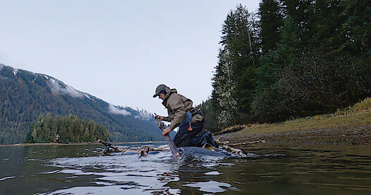 a man using a makeshift raft