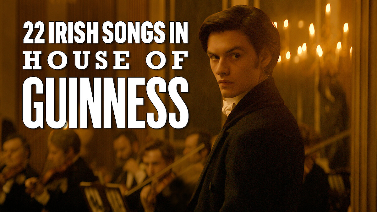 Louis Partridge in front of an orchestra with the title of that reads 22 Irish Songs In House of Guinness